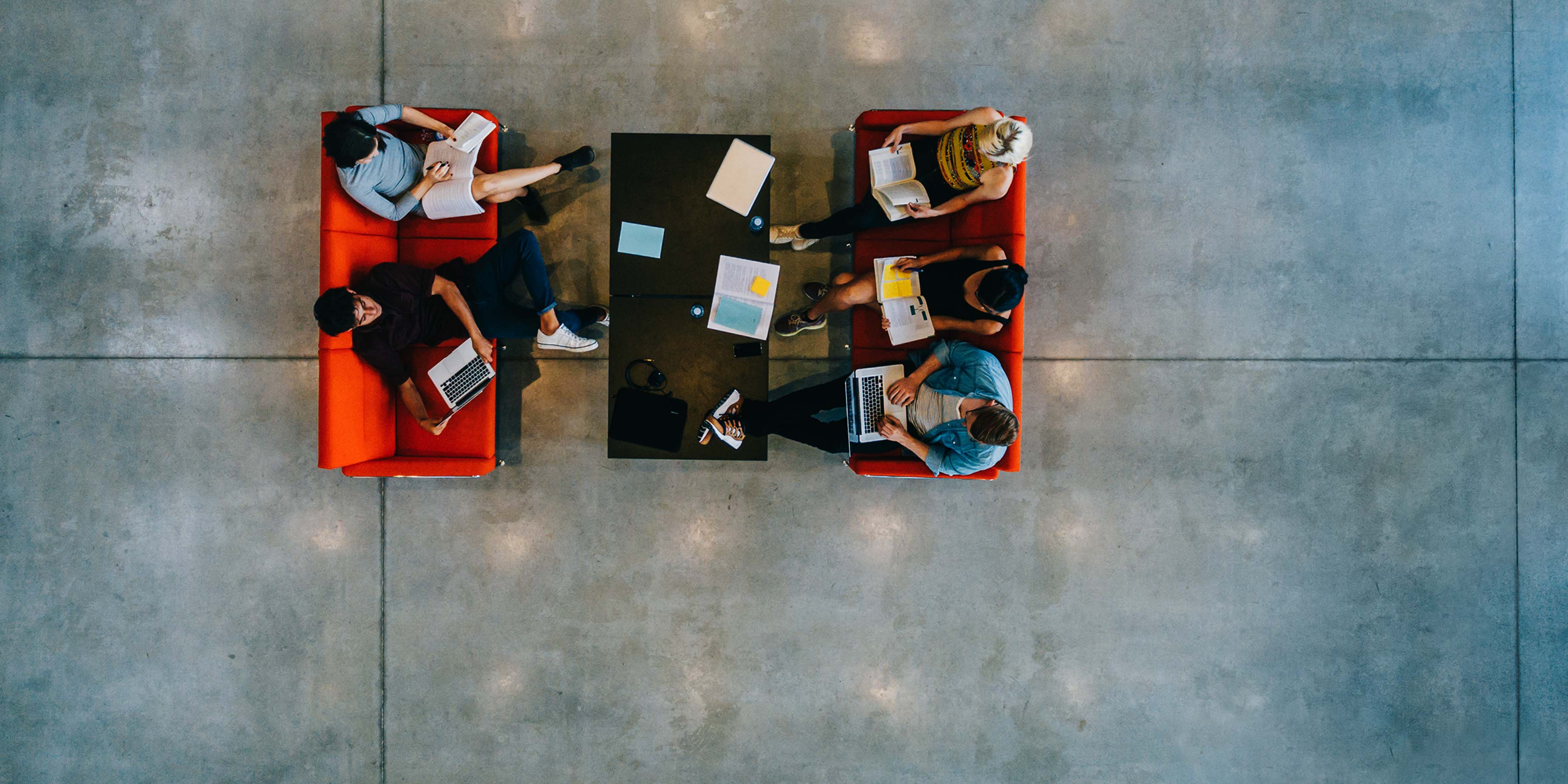 Team working informally on couches